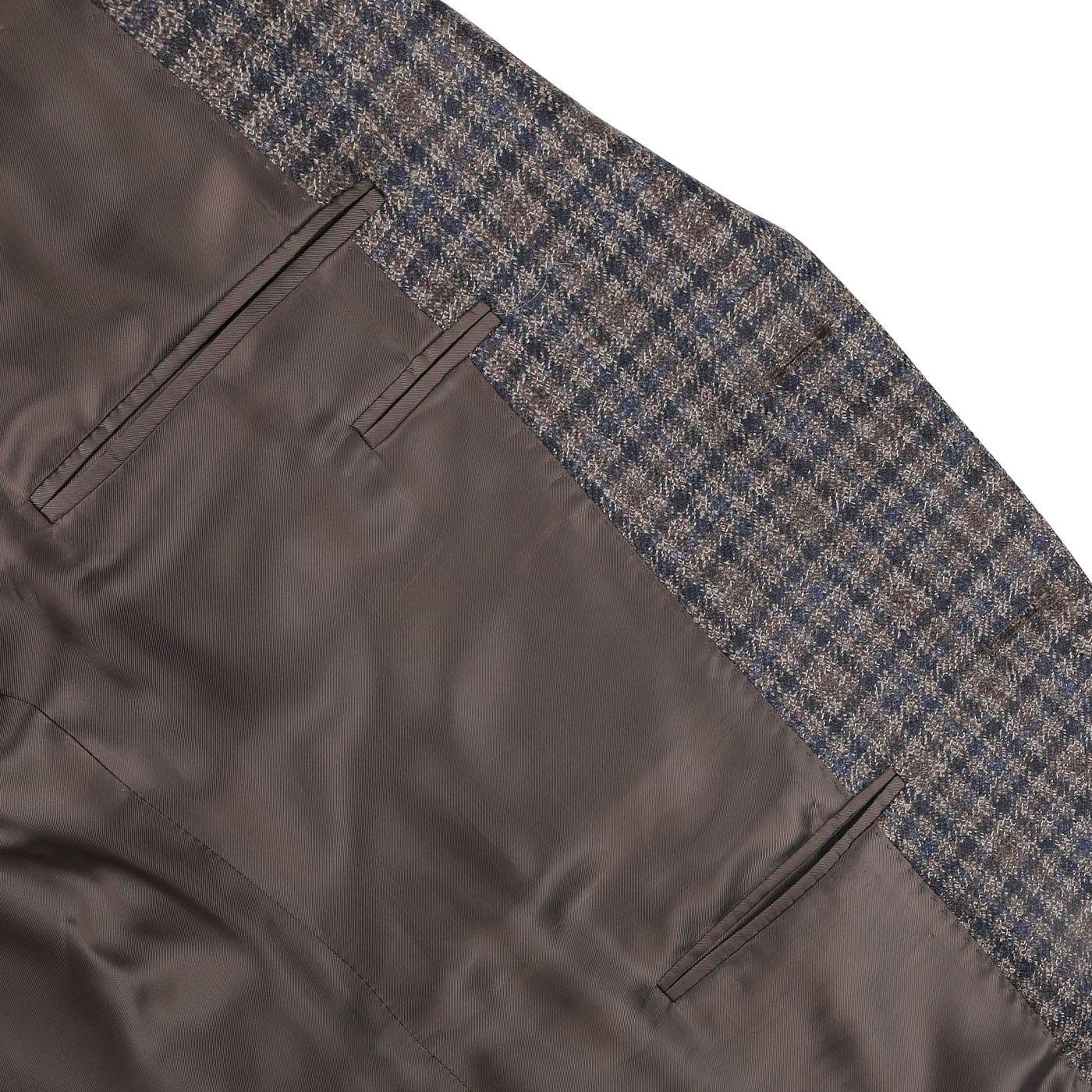 Close-up of the Canali Brown Gunclub Check Wool Drop 6 Blazer showing the interior waistband design with a gunclub check pattern and two vertical pockets. The fabric inside appears as pure wool, brown, and smooth.