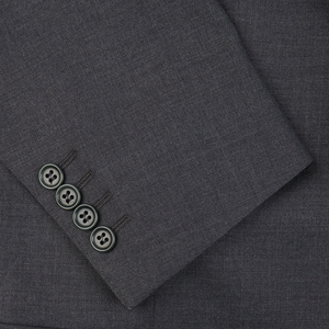 A close up of a formal charcoal grey Canali suit with buttons.