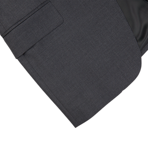 A close up of a timeless, formal charcoal grey Canali suit jacket.