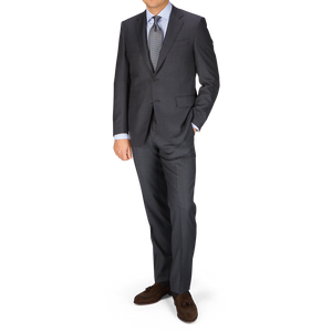 A man in a timeless Canali Charcoal Grey Wool Notch Lapel Suit.