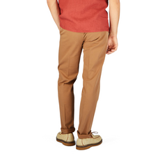 The man in a red shirt and tan pants is styled in Canali Terracotta Cotton Stretch Flat Front Chinos.