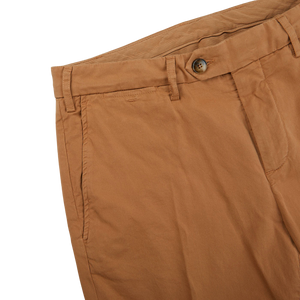 A close up of a pair of Canali Terracotta Cotton Stretch Flat Front Chinos with a distressed appearance.
