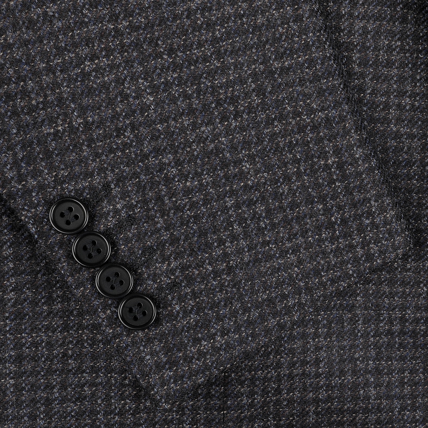 Close-up of a sleeve from the Canali Dark Blue Checked Wool Drop 6 Blazer, showcasing four sleek black buttons.