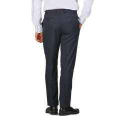 A person in a white shirt and Canali Dark Blue Melange Wool Flat Front Trousers with side pockets, standing with their back to the camera.