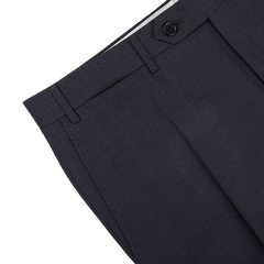 Detailed view of the Canali Dark Blue Melange Wool Flat Front Trousers, showcasing a black button and belt loops against a light gray background.