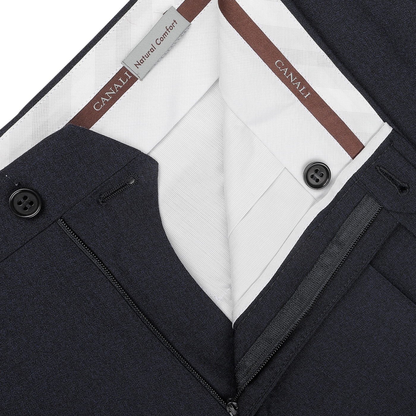 Close-up of a pair of dark blue melange, tailored fit trousers with a partially open front zipper and button, subtly revealing a white lining and Canali brand labels.