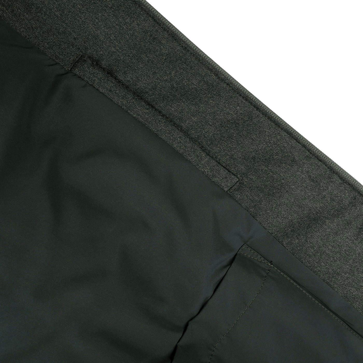 Close-up of a gray and dark green fabric, highlighting a seam and pocket detail on the Canali Dark Green Wool Fur Collar Bomber Jacket, known for its rain-resistant properties.