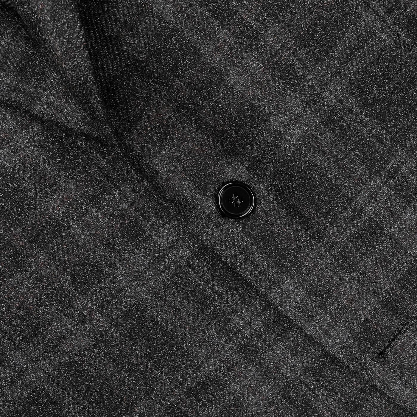 Close-up of the Dark Grey Checked Wool Silk Drop 6 Blazer by Canali, featuring a dark gray plaid fabric synonymous with Milanese style and accented with a single black button.