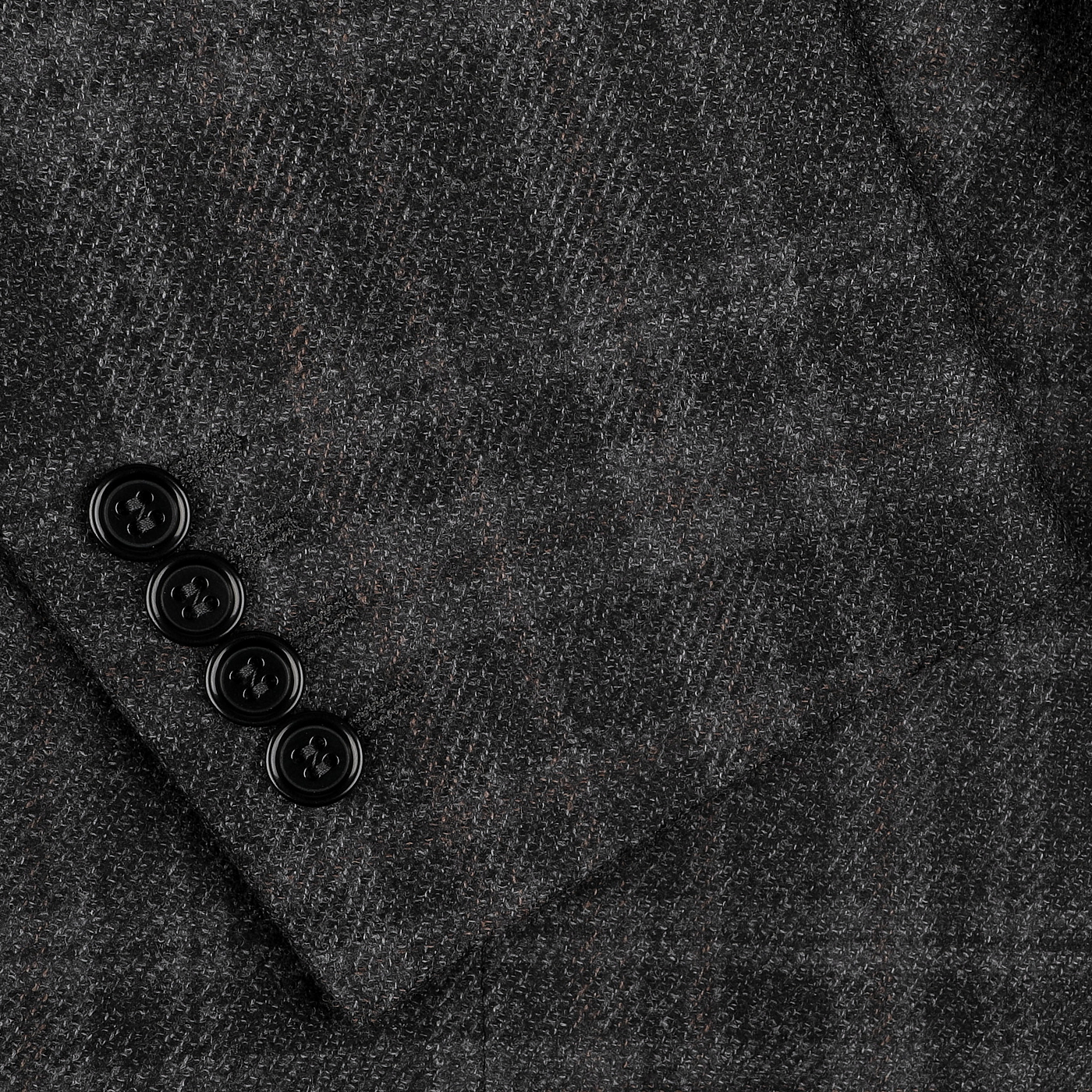 Close-up of the Canali Dark Grey Checked Wool Silk Drop 6 Blazer, showcasing a refined blend of wool and silk in the classic Milanese design, with a subtle gray plaid pattern and four elegant black buttons on the sleeve cuff.