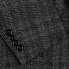 Close-up of the Canali Dark Grey Checked Wool Silk Drop 6 Blazer, showcasing a refined blend of wool and silk in the classic Milanese design, with a subtle gray plaid pattern and four elegant black buttons on the sleeve cuff.