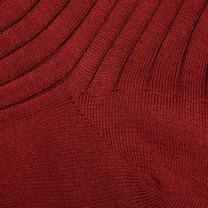 A close up of Canali dark red ribbed cotton socks.