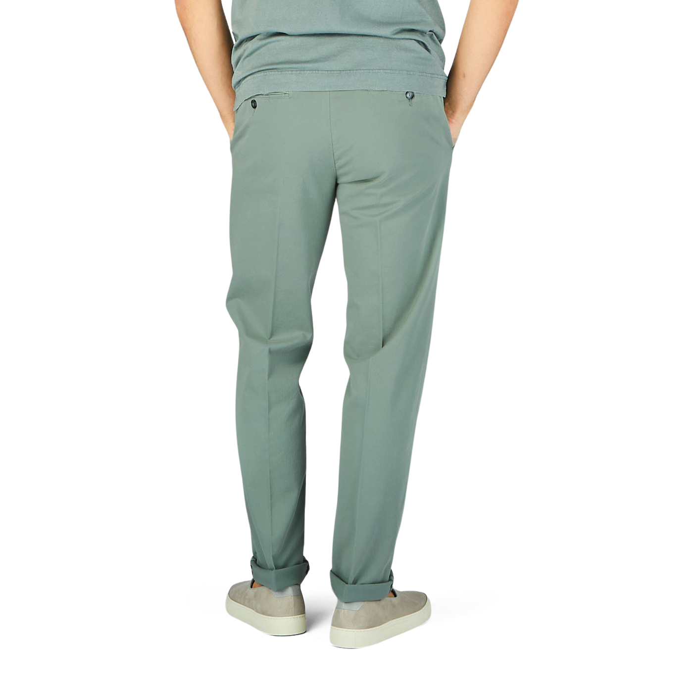 The man is wearing sage green cotton stretch flat front chinos from Canali.