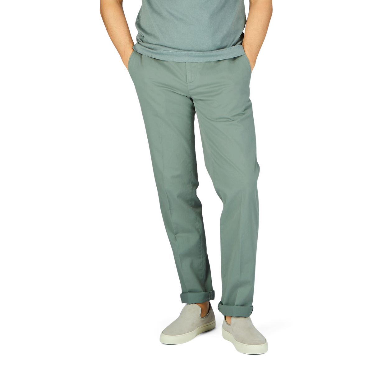 A man wearing Sage Green Cotton Stretch Flat Front Chinos from Canali and a white cotton shirt.