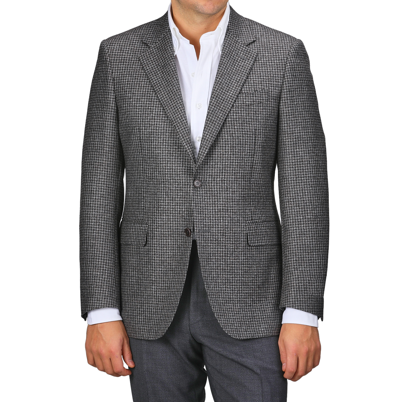 Wearing a Grey Dogtooth Wool Drop 6 Blazer from Canali over a white shirt exudes timeless elegance.