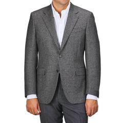 Wearing a Grey Dogtooth Wool Drop 6 Blazer from Canali over a white shirt exudes timeless elegance.