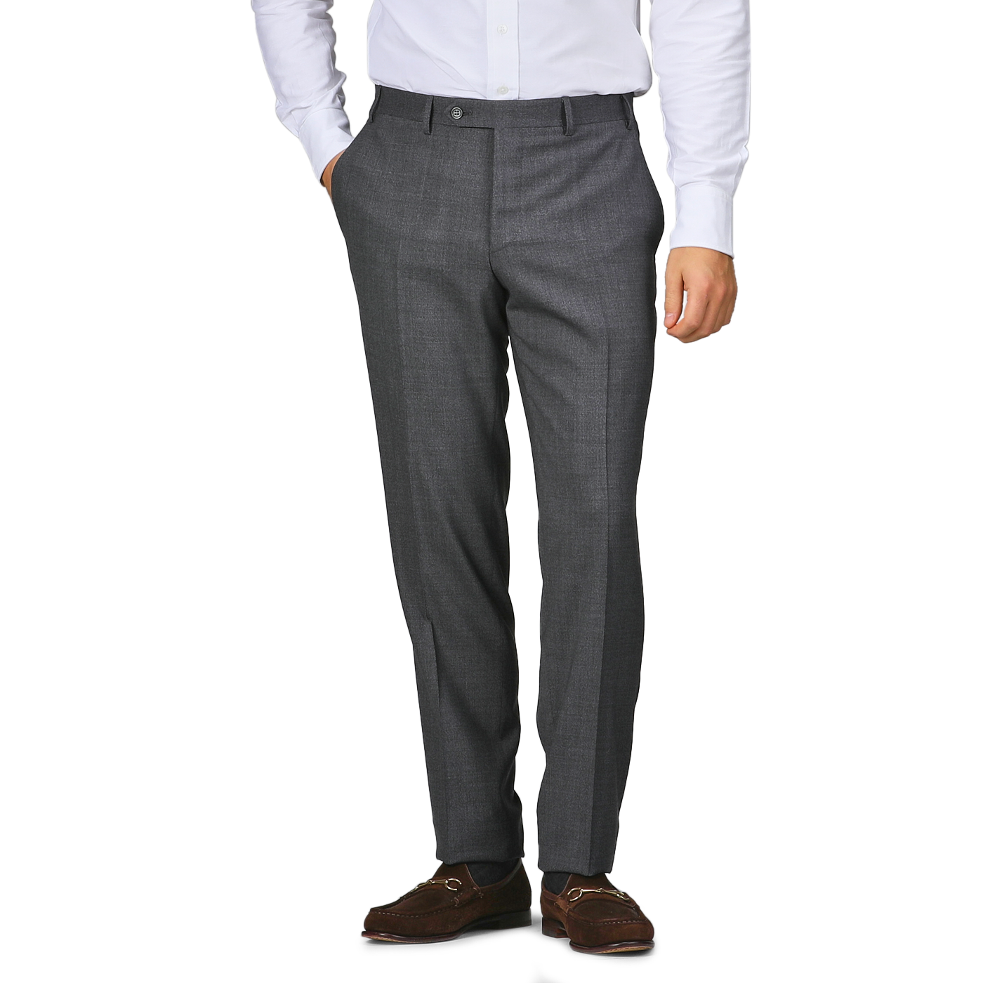 A person wearing Canali Grey Melange Wool Flat Front Trousers, a white shirt, and brown shoes stands with one hand in their pocket.