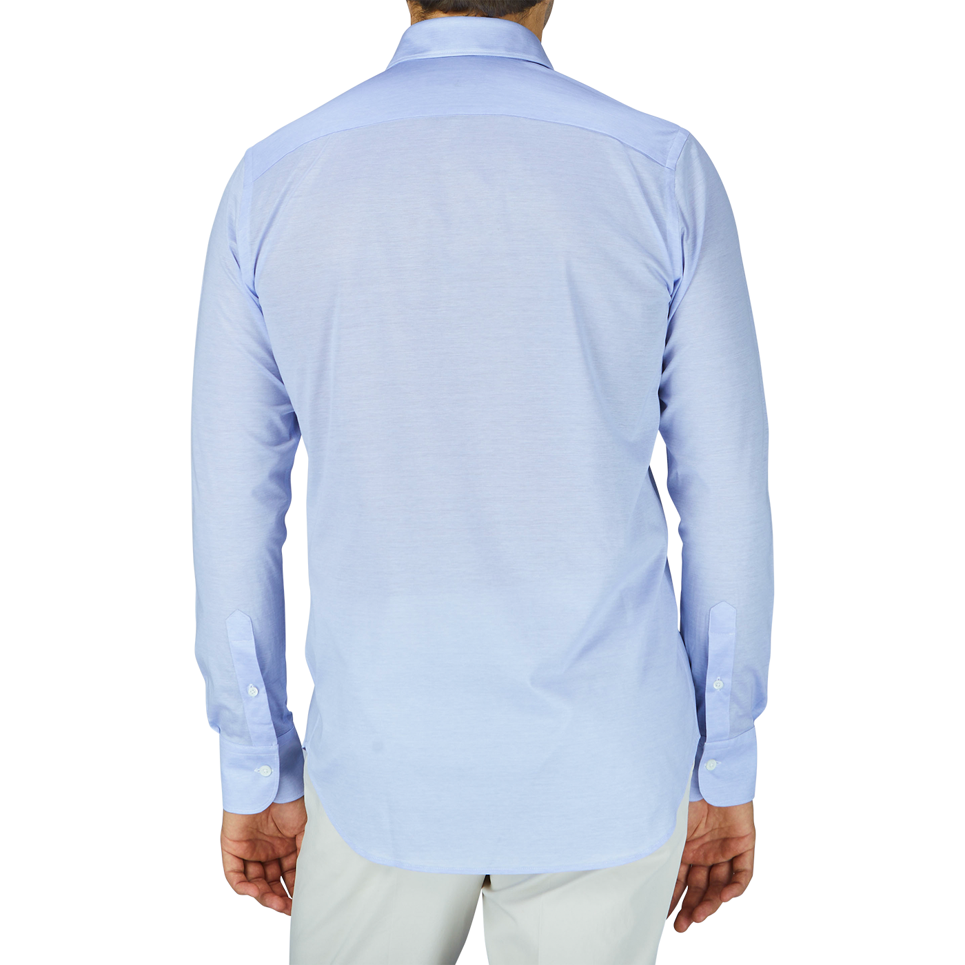 The back view of a contemporary man in a light blue Canali cotton jersey casual shirt.