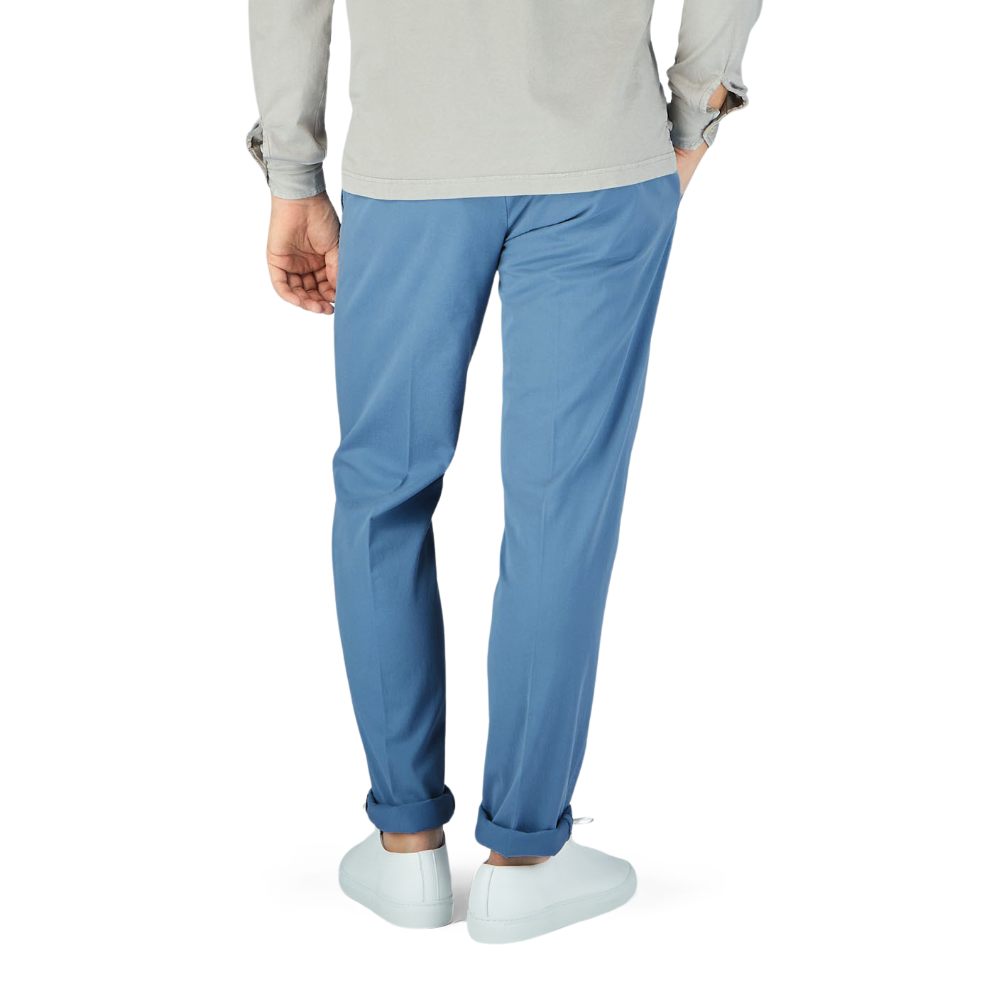 A man is seen from behind wearing Canali Light Blue Cotton Stretch Flat Front Chinos.