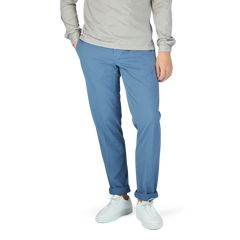 A man wearing Canali Light Blue Cotton Stretch Flat Front Chinos and a grey sweater.