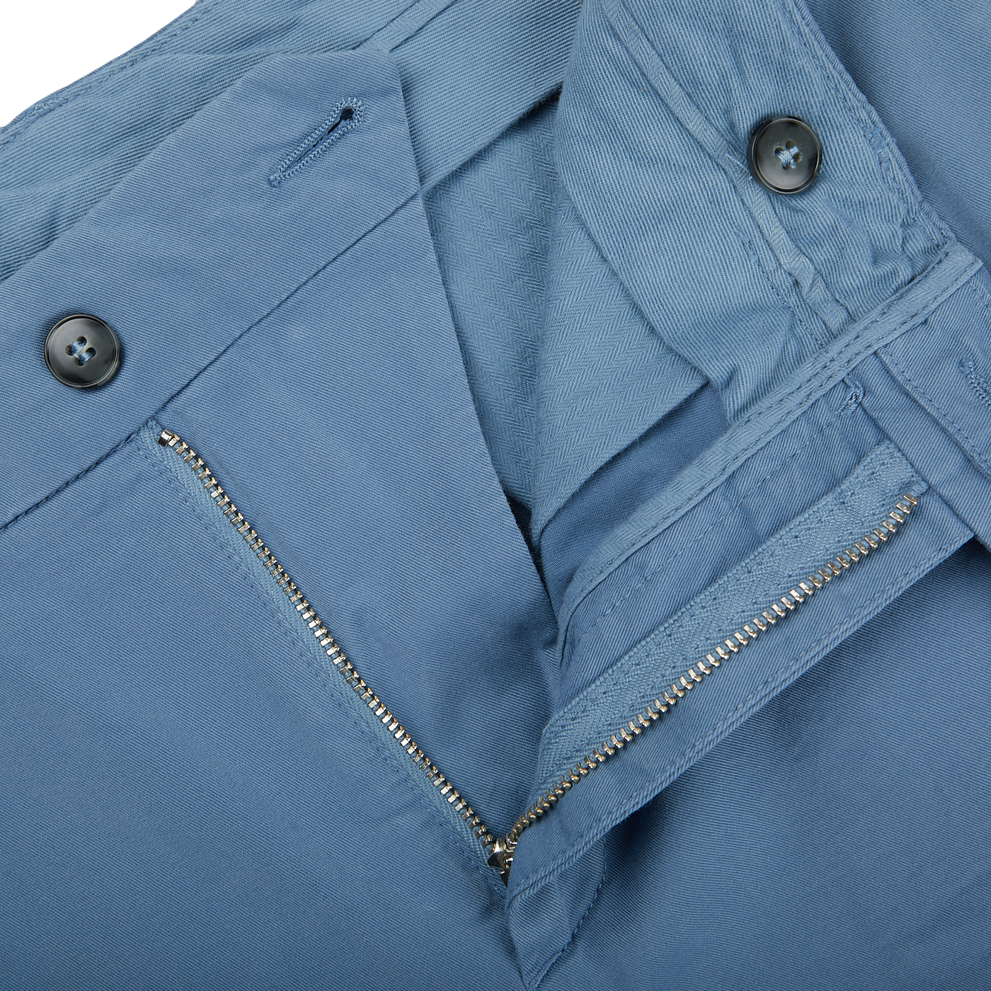 A close up of a distressed Light Blue Cotton Stretch Flat Front Chinos pant with zippers by Canali.