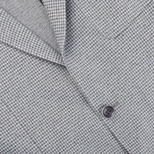 A close up of a Light Grey Houndstooth Cotton Jersey Blazer by Canali, showcasing casual tailoring in soft jersey fabric.