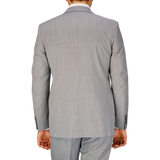 A man seen from behind wearing a Canali Light Grey Micro Check Wool Suit.
