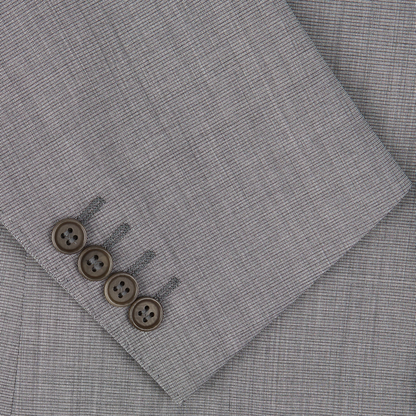 Four brown buttons on the sleeve of a Canali Light Grey Micro Check Wool Suit embody classic sartorial elegance.