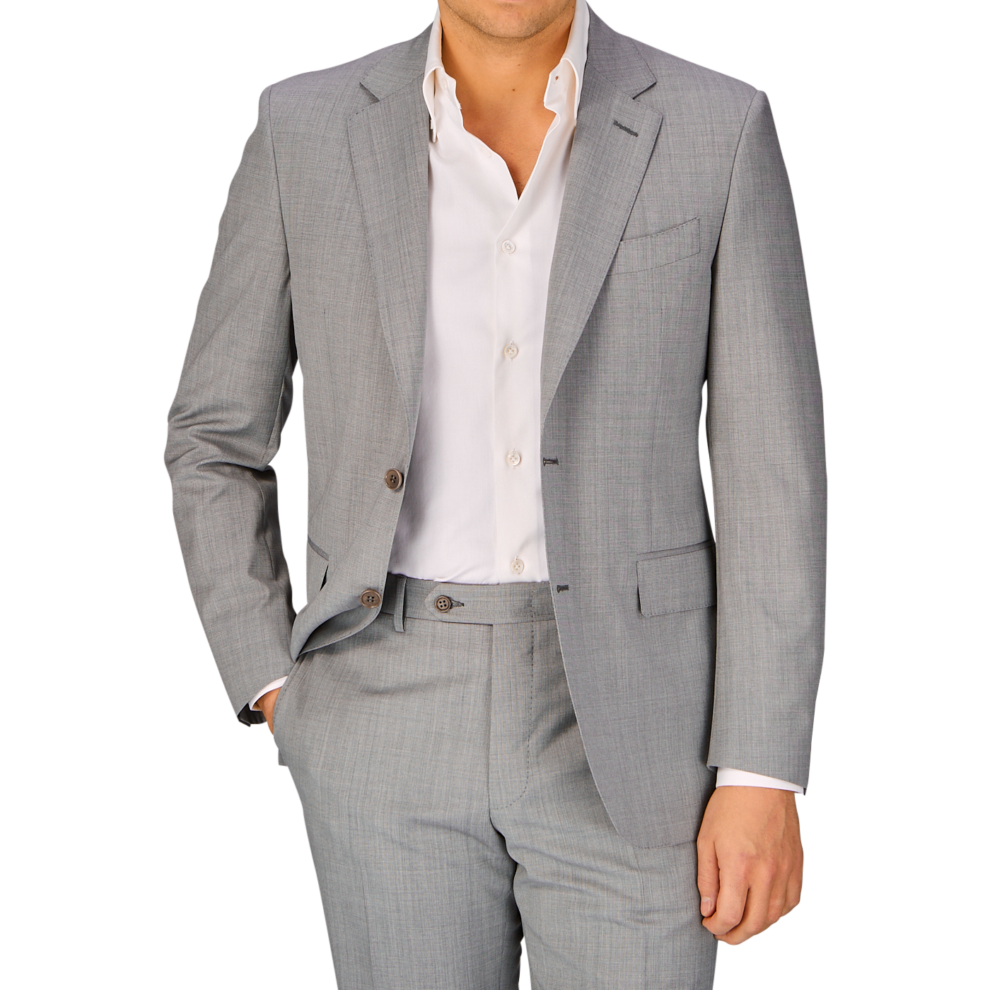 A man wearing a Canali Light Grey Micro Check Wool Suit, featuring full canvas construction and a white shirt with no tie, embodies classic sartorial elegance.