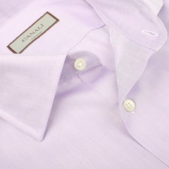 Close-up of the Lilac Cotton Herringbone Single Cuff Shirt by Canali, showcasing its ultra-soft cotton fabric, traditional herringbone pattern, folded collar, and white buttons.