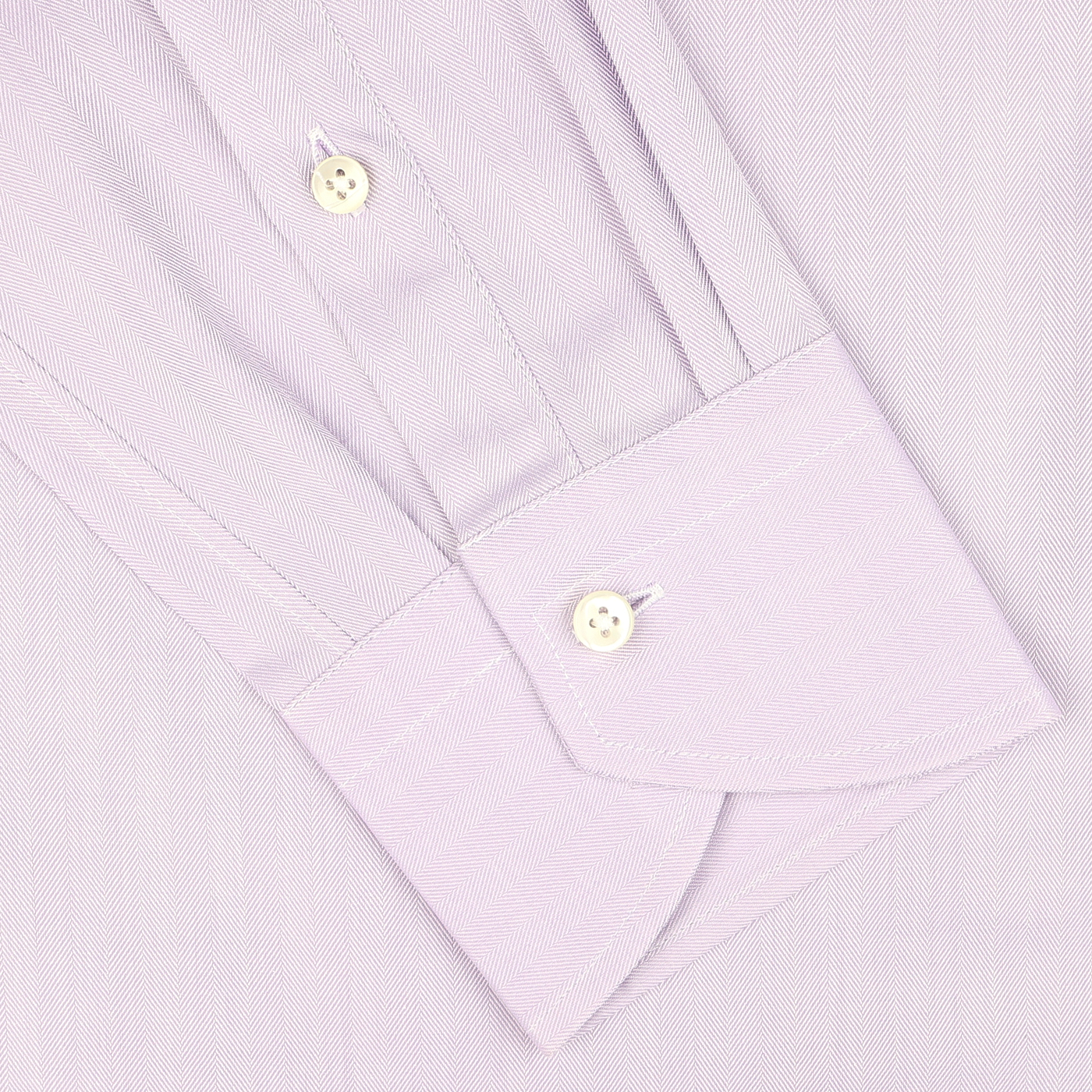 Close-up of a Canali Lilac Cotton Herringbone Single Cuff Shirt cuff, featuring two white buttons and a subtly sophisticated pattern.