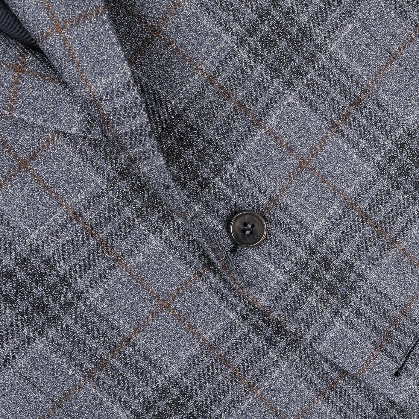 Close-up of the Canali Mid Blue Checked Wool Silk Drop 6 Blazer, featuring a black button and crafted in a classic Milanese style using a luxurious wool-silk blend.