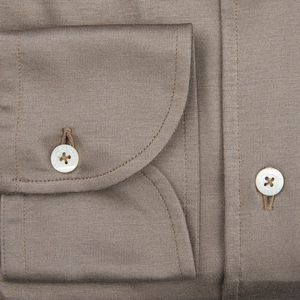 A close up of a Canali Mushroom Brown Cotton Jersey Casual Shirt with buttons, perfect for the contemporary man.