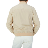 A man in a Canali Navy Blue Beige Reversible Technical Blouson jacket.