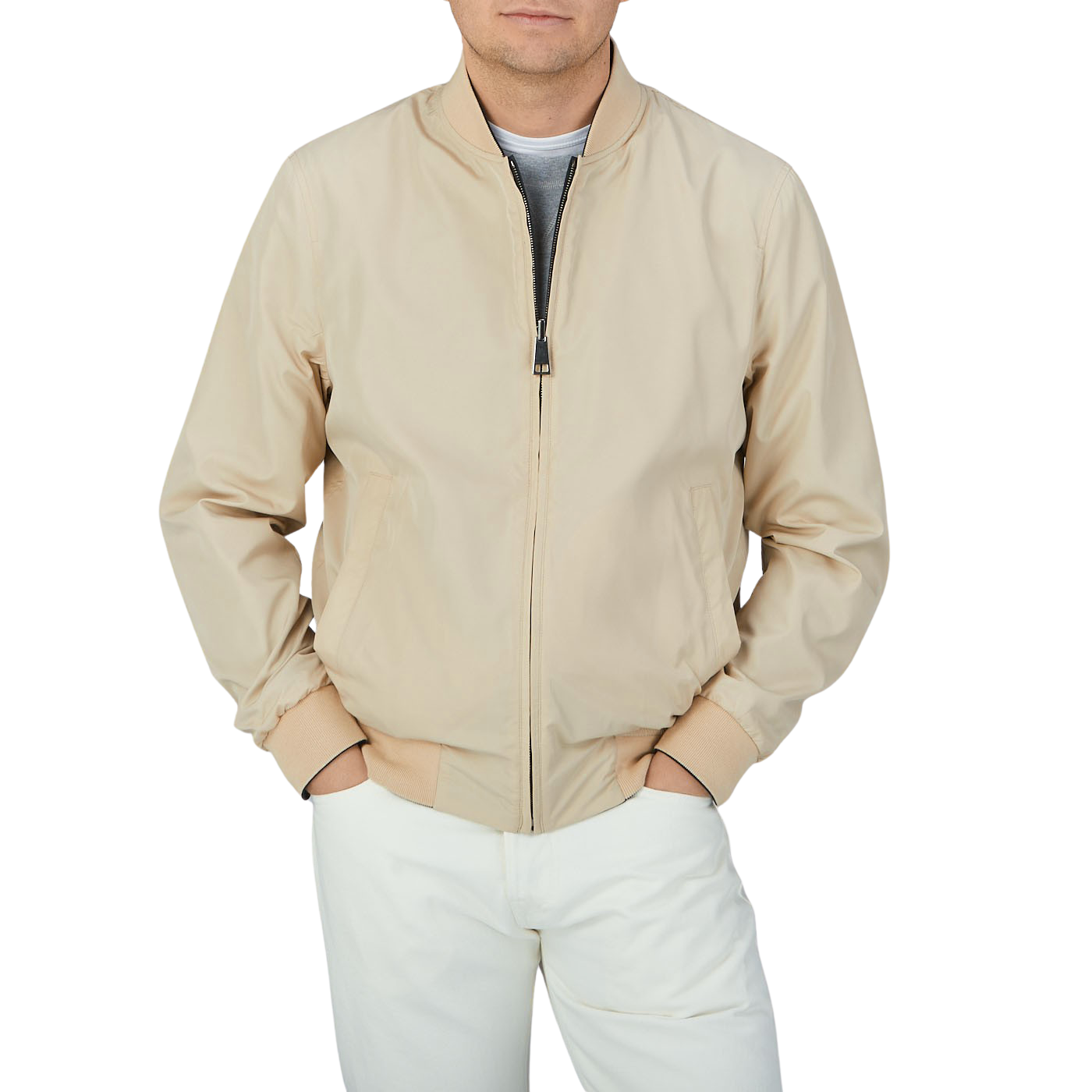 A man wearing a Canali Navy Blue Beige Reversible Technical Blouson with his hands in pockets.