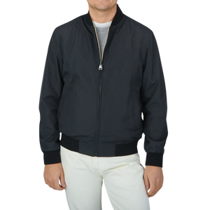 A Canali Navy Blue Beige Reversible Technical Blouson featuring a man in a black jacket made of technical nylon.