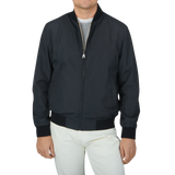 A Canali Navy Blue Beige Reversible Technical Blouson featuring a man in a black jacket made of technical nylon.