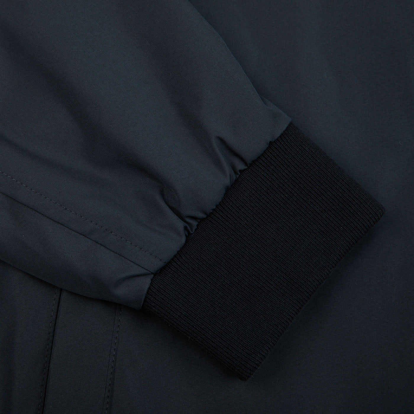 A close up of a Canali Navy Blue Beige Reversible Technical Blouson jacket made with technical nylon.