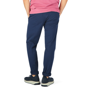 The man is wearing navy blue Canali Navy Blue Cotton Stretch Flat Front Chinos and a pink Canali shirt.