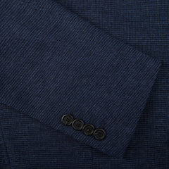 A close up of a Canali Navy Blue Melange Wool Jersey Jacket with buttons in casual tailoring.