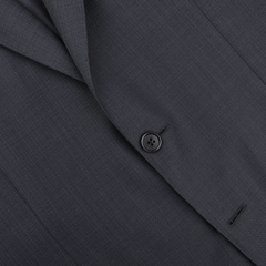 Close-up of Canali's Navy Blue Micro Design Wool Suit jacket, highlighting its single black button, embodying classic sartorial elegance.