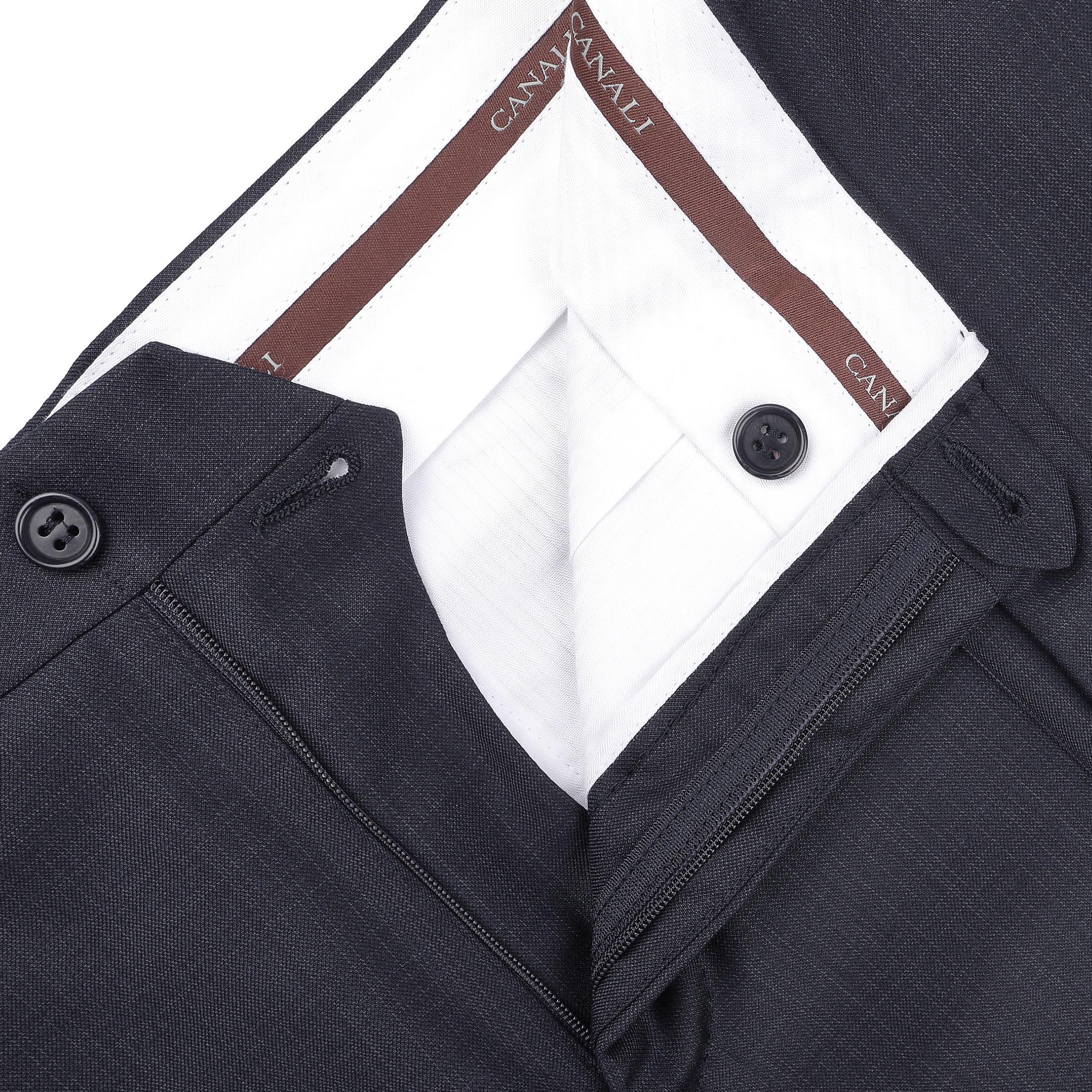 Close-up of navy blue formal suit trousers with micro design, featuring classic sartorial elegance and a brown waistband labeled "Canali".