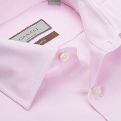 Close-up of a folded Pink Cotton Single Cuff Shirt by Canali, featuring white buttons and the label inside the collar.