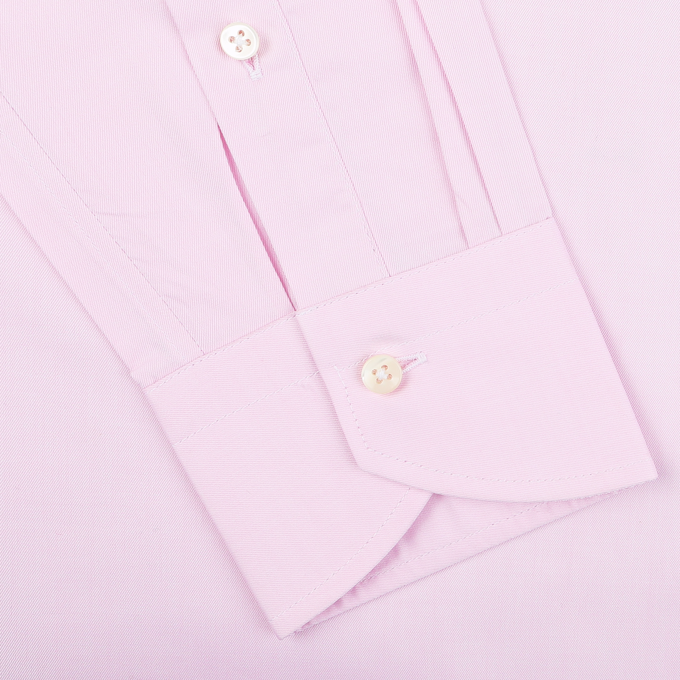 Close-up of a Canali Pink Cotton Single Cuff Shirt sleeve, showcasing a buttoned cuff that epitomizes the elegance of this formal shirt.