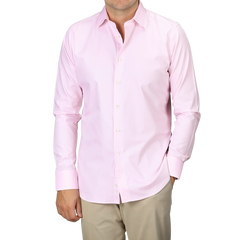 An individual is wearing a Pink Cotton Single Cuff Shirt by Canali paired with beige pants, and their face is not visible.