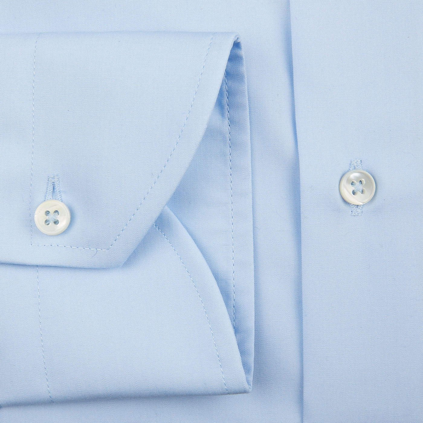A close up of a Canali Plain Blue Cotton Poplin Single Cuff Shirt.