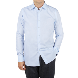 A man wearing a Canali shirt in sky blue dressed.