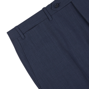 Close-up of a slate blue semi-plain wool Canali dress pants waistband with button closure.