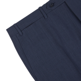 Close-up of a slate blue semi-plain wool Canali dress pants waistband with button closure.