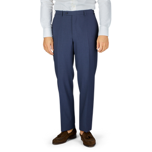 Man standing in navy Canali Slate Blue Semi-Plain Wool Flat Front Trousers paired with brown shoes.