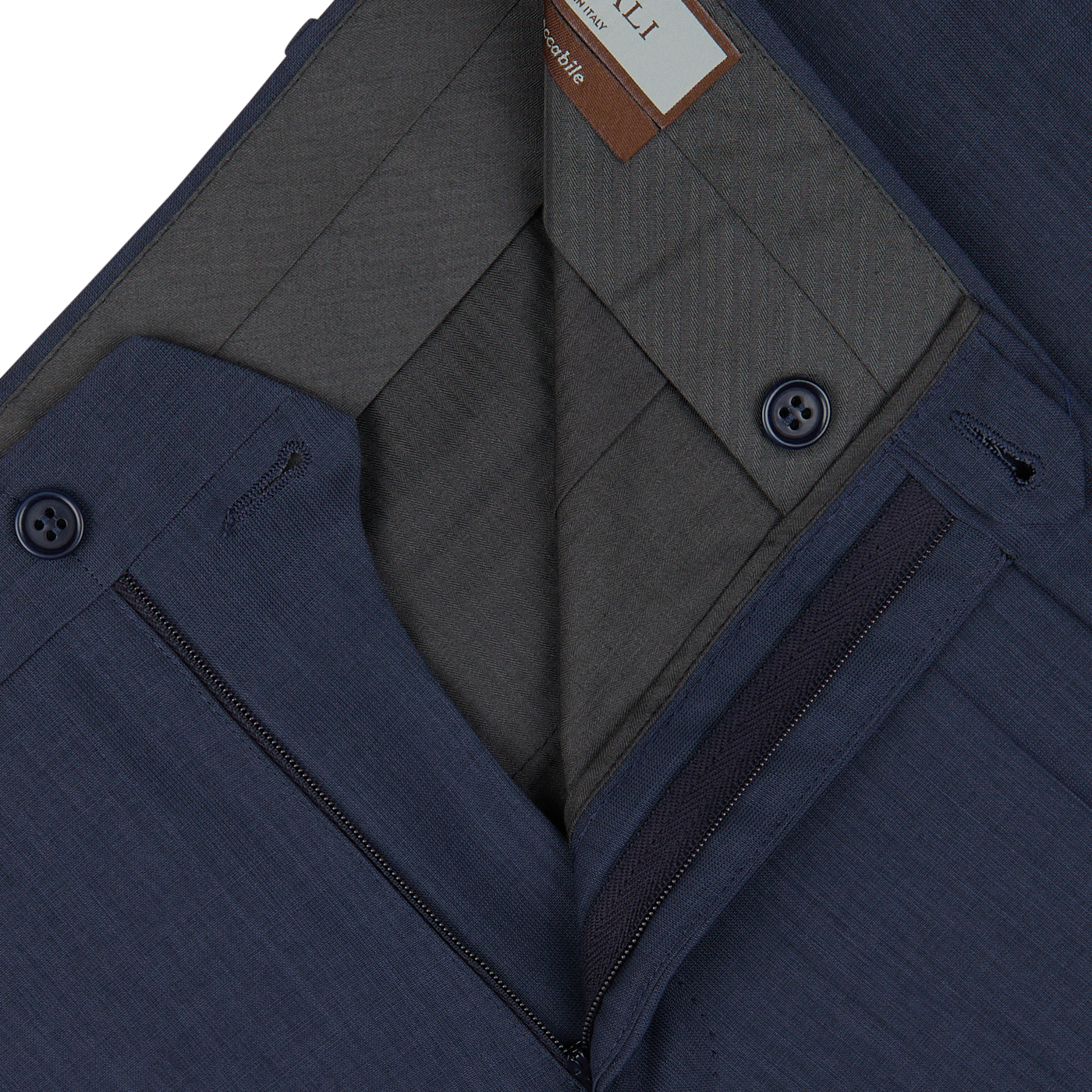 Close-up of a navy blue men's Canali suit jacket with detailed inner lining and Slate Blue Semi-Plain Wool Flat Front Trousers.
